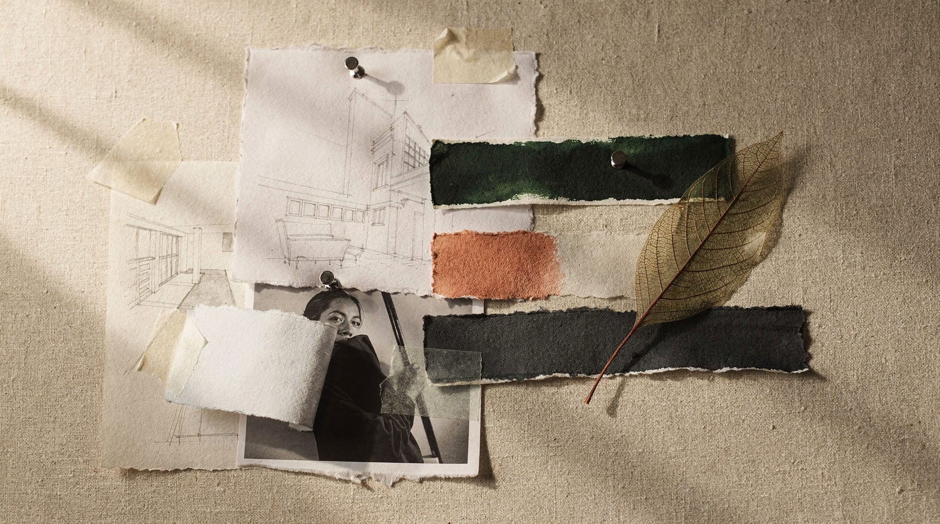 References and sketches arranged on a work surface